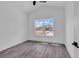 Bedroom with grey flooring and a large window with a view of the neighborhood at 729 Jade Dr., Myrtle Beach, SC 29579