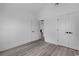 Minimalist bedroom with gray floors, white walls, white trim, and doors with black hardware at 729 Jade Dr., Myrtle Beach, SC 29579