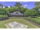 Sago Plantation entrance with lush landscaping and brick signage for a welcoming feel at 729 Jade Dr., Myrtle Beach, SC 29579