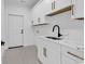 Well-lit laundry room with modern appliances, granite counters, and ample cabinet space at 729 Jade Dr., Myrtle Beach, SC 29579