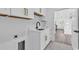 Bright laundry room with custom cabinets and granite counters with access to kitchen at 729 Jade Dr., Myrtle Beach, SC 29579