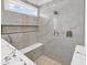 Modern shower featuring marble-look tile, niche, bench, and multiple shower heads at 729 Jade Dr., Myrtle Beach, SC 29579