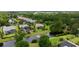 Aerial view of a beautiful home with a screened-in pool, lush landscaping, and serene water features at 7961 San Marcello Dr., Myrtle Beach, SC 29579