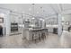 Modern kitchen features stainless steel appliances, granite countertops, and a large center island at 7961 San Marcello Dr., Myrtle Beach, SC 29579