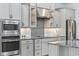 Gourmet kitchen showcases stainless steel appliances, stylish backsplash, and ample counter space at 7961 San Marcello Dr., Myrtle Beach, SC 29579