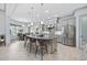 Open-concept kitchen features a large island and adjacent dining nook with views of the backyard at 7961 San Marcello Dr., Myrtle Beach, SC 29579