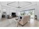 Light and airy living room with access to the pool area offers abundant natural light at 7961 San Marcello Dr., Myrtle Beach, SC 29579