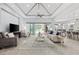 Open-concept living room offers access to a screened-in patio and pool area at 7961 San Marcello Dr., Myrtle Beach, SC 29579
