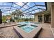 Relaxing screened-in pool area featuring a spa, water features, and comfortable lounge seating for ultimate relaxation at 7961 San Marcello Dr., Myrtle Beach, SC 29579