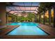 Stunning screened-in pool with brick surround, water features, and lounge seating for relaxing outdoor enjoyment at 7961 San Marcello Dr., Myrtle Beach, SC 29579