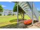 View of backyard with grassy area, small tree, and visible staircase leading to the residential units at 801 Burcale Rd. # K7, Myrtle Beach, SC 29579