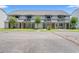 Charming townhomes featuring private balconies and well-maintained lawns under a clear blue sky at 801 Burcale Rd. # K7, Myrtle Beach, SC 29579