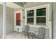 Inviting front porch with seating, perfect for relaxing and enjoying the neighborhood view at 801 Burcale Rd. # K7, Myrtle Beach, SC 29579