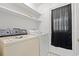 Functional laundry room equipped with a washing machine, dryer, and ample shelving for storage at 801 Burcale Rd. # K7, Myrtle Beach, SC 29579