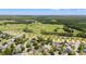 Extensive aerial view showcasing a vibrant community near a verdant golf course at 809 Berrywood Ct., Myrtle Beach, SC 29588