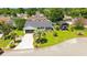 Aerial view of a beautifully landscaped home showcasing the lush lawn and convenient RV storage at 809 Berrywood Ct., Myrtle Beach, SC 29588