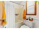 Bathroom featuring a shower with curtain, window, neutral colors, and functional fixtures at 809 Berrywood Ct., Myrtle Beach, SC 29588
