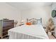 Cozy bedroom with a wrought iron bed frame, neutral walls, and basketball-themed decor at 809 Berrywood Ct., Myrtle Beach, SC 29588