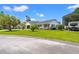 Well-maintained property with lush green lawn, covered RV parking, and inviting curb appeal at 809 Berrywood Ct., Myrtle Beach, SC 29588