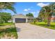 Charming single-story home featuring a well-manicured lawn, concrete driveway, and attached garage at 809 Berrywood Ct., Myrtle Beach, SC 29588