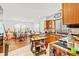 Bright kitchen with wooden cabinetry, tile flooring, breakfast bar and dining area at 809 Berrywood Ct., Myrtle Beach, SC 29588