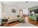 Open-concept living room with hardwood floors, seamless flow to the dining area and adjacent spaces at 809 Berrywood Ct., Myrtle Beach, SC 29588