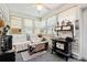 Bright sunroom filled with natural light, vintage stove, comfortable seating, and charming decor at 809 Berrywood Ct., Myrtle Beach, SC 29588