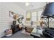 Bright sunroom with cozy seating, vintage accents, and lots of natural light at 809 Berrywood Ct., Myrtle Beach, SC 29588