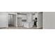 Modern kitchen with white cabinets, stainless steel appliances, and hardwood floors at 8249 Vibrant Loop, Longs, SC 29568