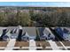 Aerial view showcases the home's location among tree-lined streets and manicured lawns at 865 Summer Starling Pl., Myrtle Beach, SC 29577