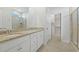 Bathroom with double sinks, granite countertop, glass shower door and a walk-in closet at 865 Summer Starling Pl., Myrtle Beach, SC 29577