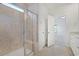Bright bathroom with a glass enclosed shower, granite countertops, and tile flooring at 865 Summer Starling Pl., Myrtle Beach, SC 29577