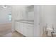 Bathroom with granite countertops, double sinks, tile floors, and access to bedroom at 865 Summer Starling Pl., Myrtle Beach, SC 29577
