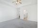 Large bedroom with a ceiling fan, three windows and an ensuite bathroom and walk-in closet at 865 Summer Starling Pl., Myrtle Beach, SC 29577