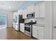 The kitchen features stainless steel appliances, ample white cabinetry, and an open design at 865 Summer Starling Pl., Myrtle Beach, SC 29577