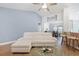 Open floor plan showcases a modern living room that flows to a dining area and breakfast bar at 865 Summer Starling Pl., Myrtle Beach, SC 29577