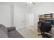 Cozy home office with a sofa, desk, and ample storage with natural light at 865 Summer Starling Pl., Myrtle Beach, SC 29577