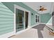 Covered patio with a ceiling fan and sliding glass doors leading to backyard at 865 Summer Starling Pl., Myrtle Beach, SC 29577