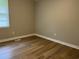 A cozy bedroom features light-colored walls and natural light from the window at 876 S Clay Field Rd, Johnsonville, SC 29555