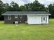 Home exterior with a small addition off the back and a large yard at 876 S Clay Field Rd, Johnsonville, SC 29555