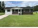 Charming single-story home with brick and vinyl siding and a well-manicured front lawn at 876 S Clay Field Rd, Johnsonville, SC 29555