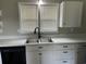 Kitchen featuring white cabinets, a stainless steel sink, modern fixtures, and white countertops at 876 S Clay Field Rd, Johnsonville, SC 29555