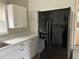 Cozy kitchen featuring white cabinets, black appliances, and a clean, bright aesthetic at 876 S Clay Field Rd, Johnsonville, SC 29555