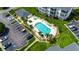 Aerial shot showcasing community pool, hot tub, palm trees and pristine green spaces at Carolina Keyes at 901 West Port Dr. # 712, North Myrtle Beach, SC 29582