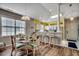 Open concept dining area with a glass table, modern chairs and adjacent to the kitchen with breakfast bar at 901 West Port Dr. # 712, North Myrtle Beach, SC 29582