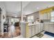 Bright and airy kitchen with white cabinetry, stainless steel appliances, and an open view to the living area at 901 West Port Dr. # 712, North Myrtle Beach, SC 29582