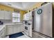 Bright kitchen with stainless steel appliances, white cabinetry, and stylish backsplash, great for modern living at 901 West Port Dr. # 712, North Myrtle Beach, SC 29582