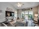 Spacious living room with sliding glass doors to the sunroom and a beach-themed decor at 901 West Port Dr. # 712, North Myrtle Beach, SC 29582