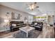 Open-concept living room with modern decor, hardwood floors, and seamless flow to the kitchen at 901 West Port Dr. # 712, North Myrtle Beach, SC 29582