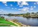 Scenic water view showcasing a dock, pristine waterfront, lush landscaping, and blue skies at 901 West Port Dr. # 712, North Myrtle Beach, SC 29582